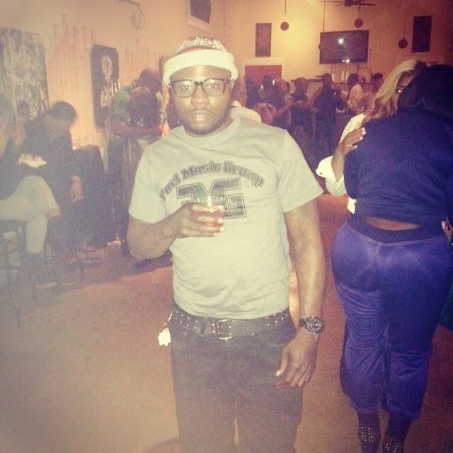 A community member wearing a Furl Music Group shirt at a gathering